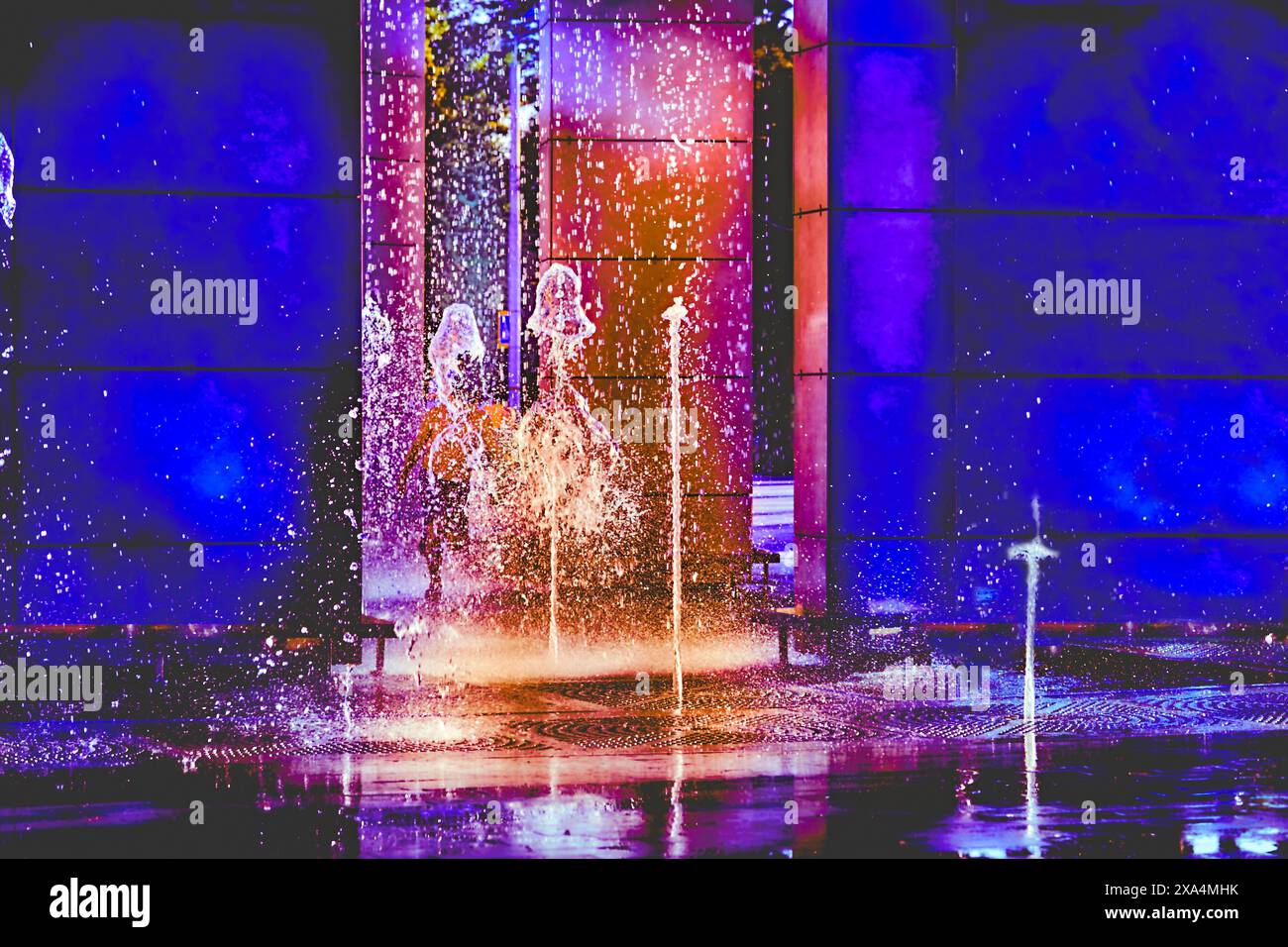 Water,light.Glowing multi colored decorative fountains Stock Photo
