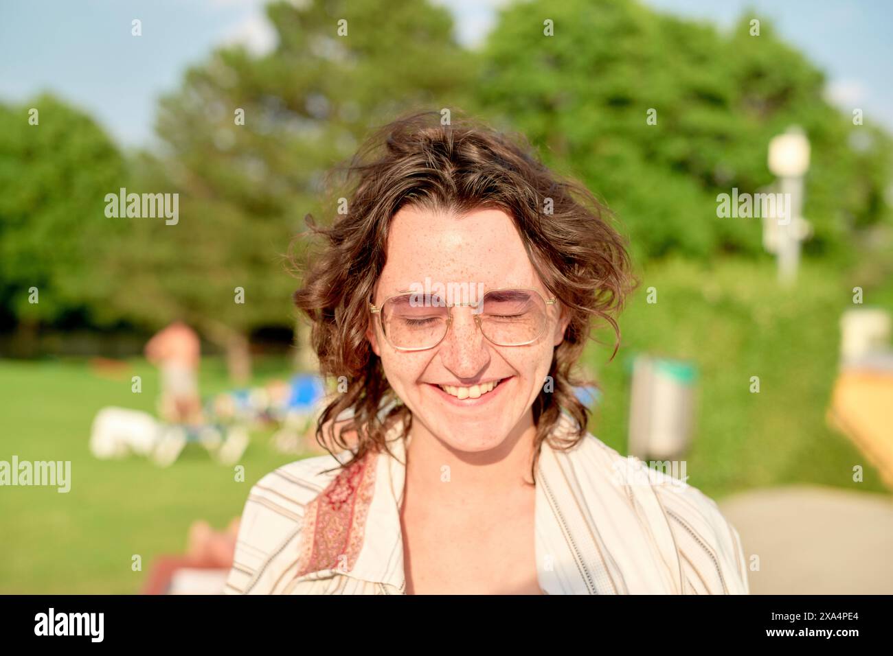 Woman curly hair in glasses hi-res stock photography and images - Alamy