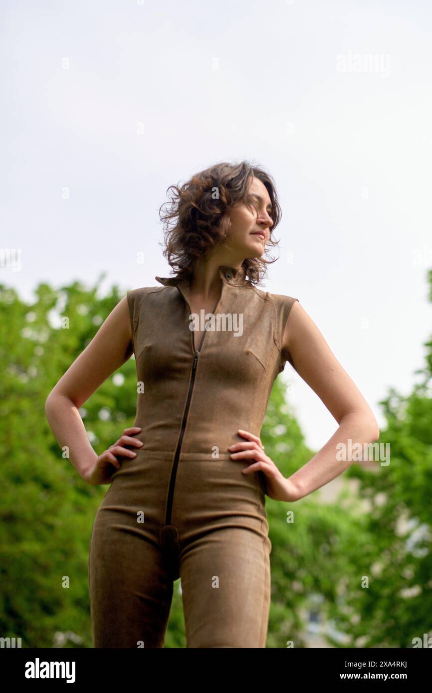 Woman standing outdoors hi-res stock photography and images - Alamy