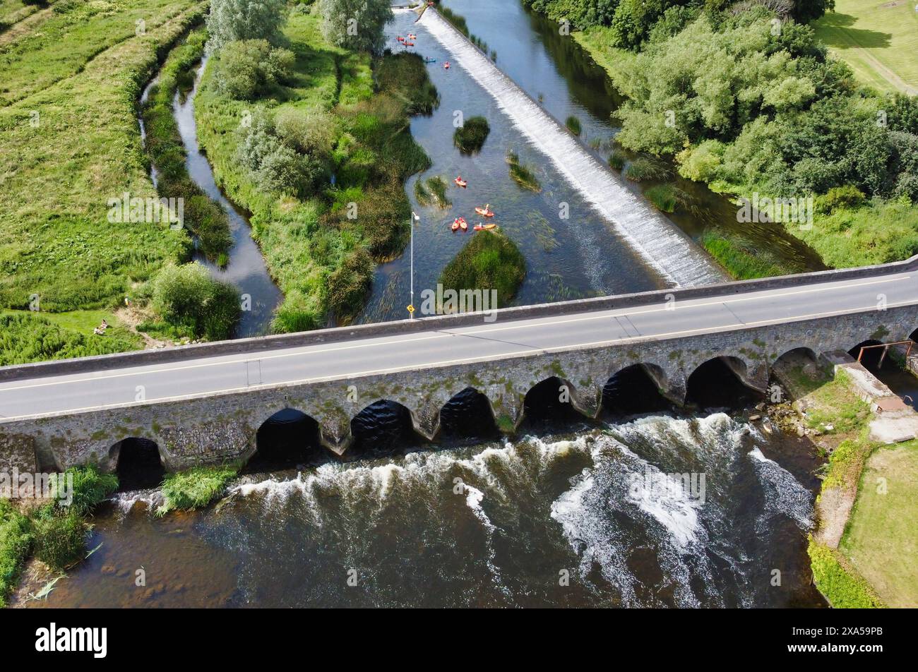 An aerial view of a bridge over a river, surrounded by trees Stock ...