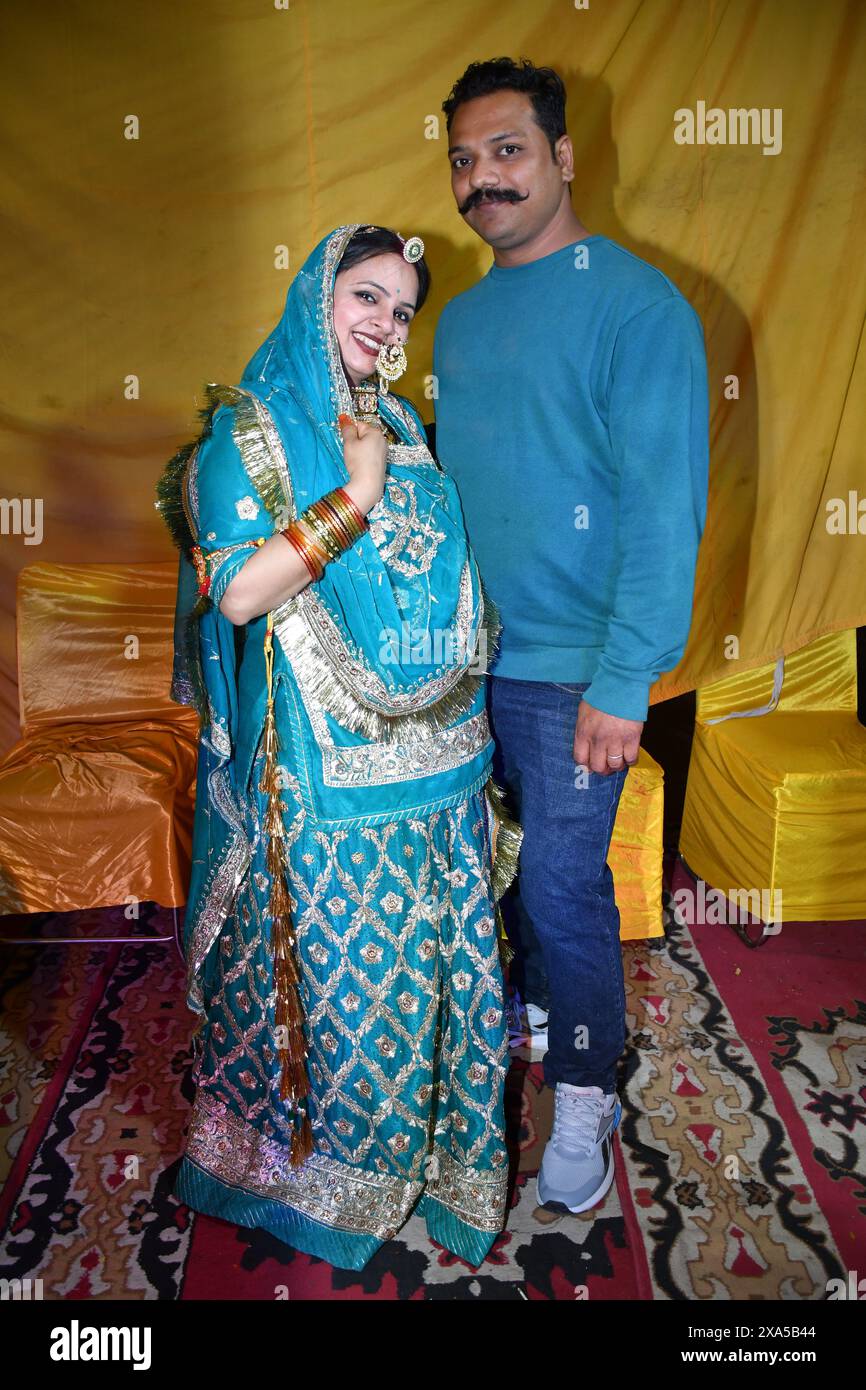 A couple posing for a photo on a carpet Stock Photo