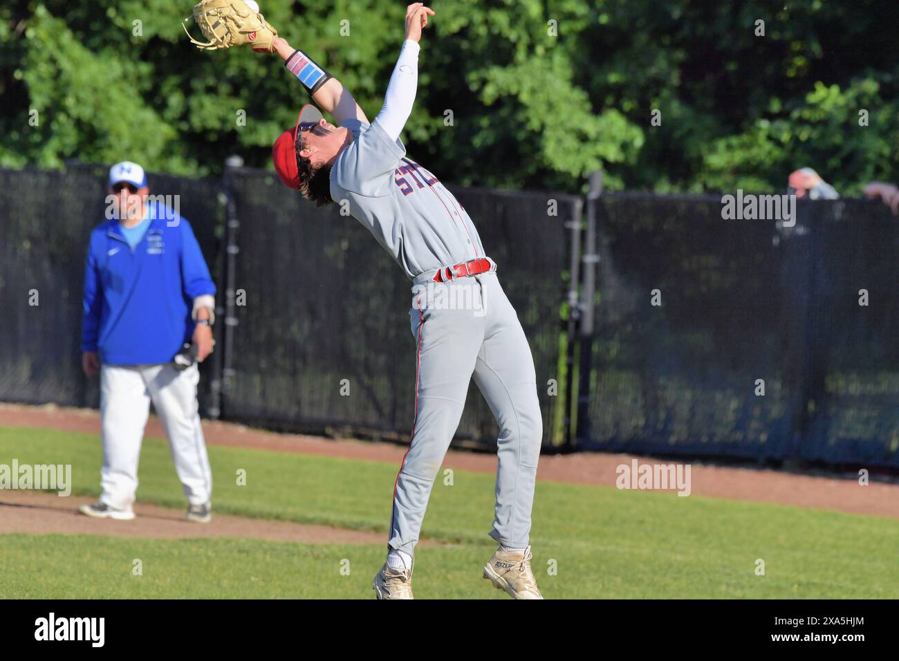 South Elgin first baseman Jacob Robertson lunging back to make a catch South Elgin first baseman Jacob Robertson lunging back to make a catch