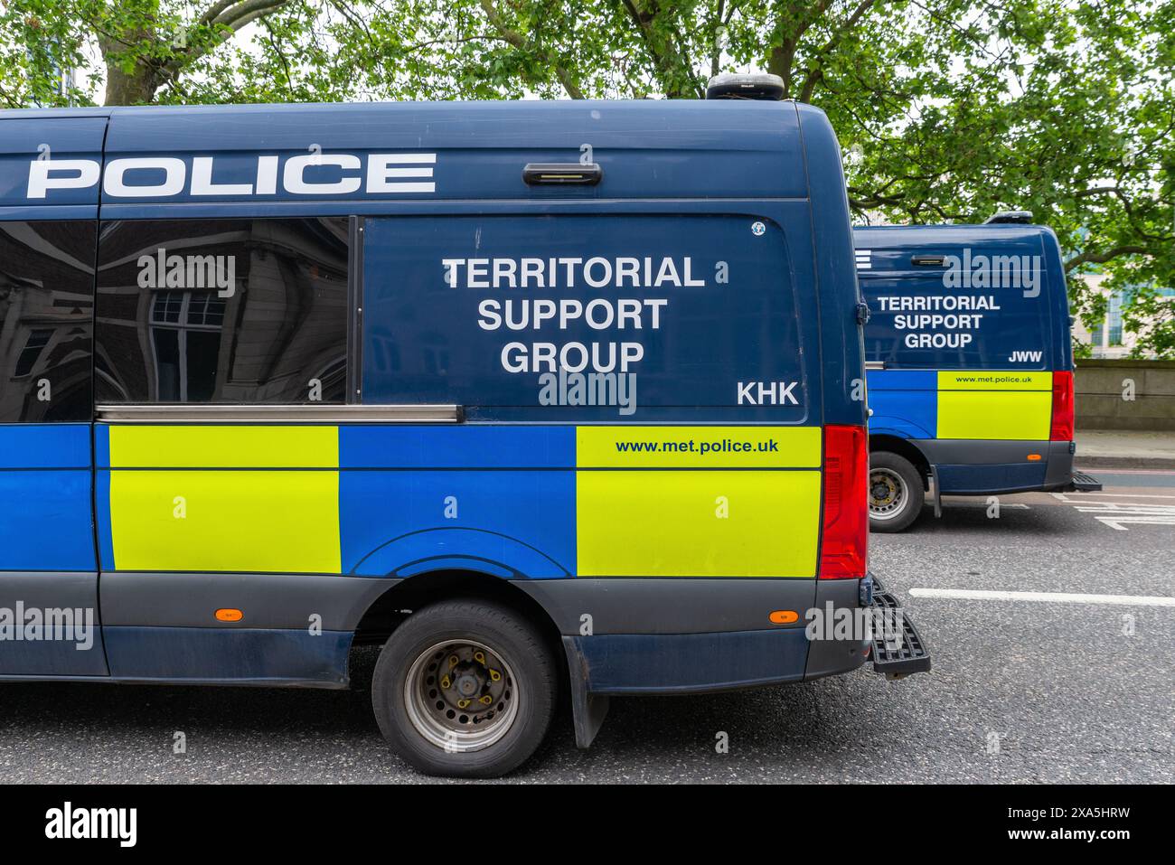 Metropolitan Police Territorial Support Group vans, Millbank, London ahead of a protest march against two tier policing. Ready to block confrontation Stock Photo