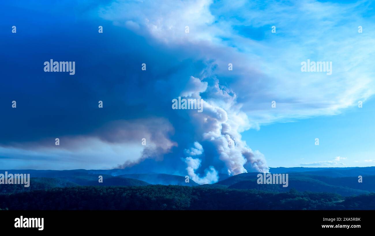 Drone aerial photograph of controlled bush fire hazard reduction burning by the Rural Fire Service in the Blue Mountains in NSW, Australia. Stock Photo