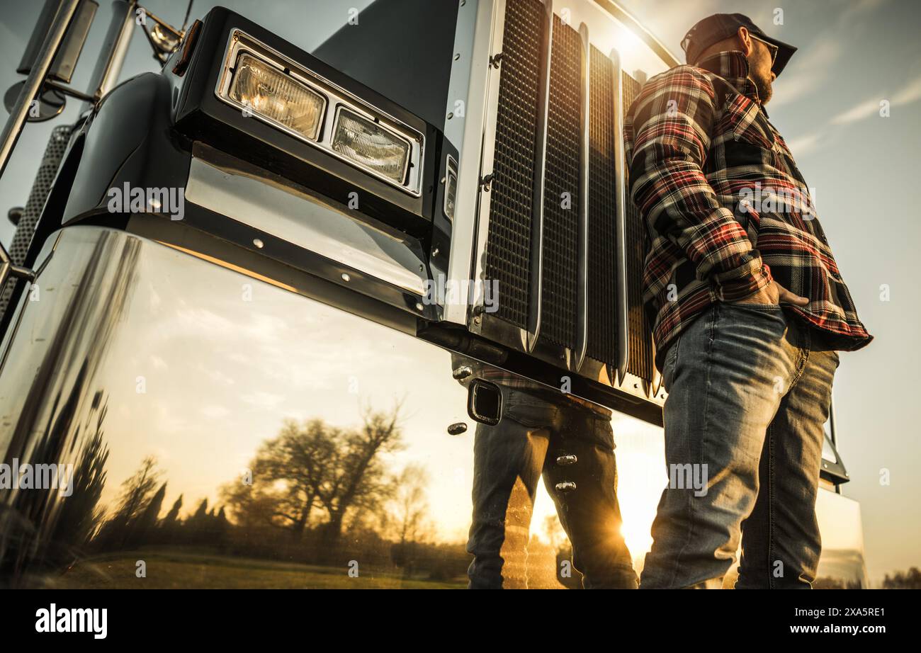 A Semi Truck Driver Job Concept standing in front of his truck Stock ...