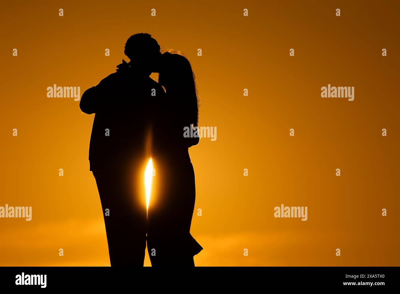 Silhouette man kissing wife hi-res stock photography and images - Alamy