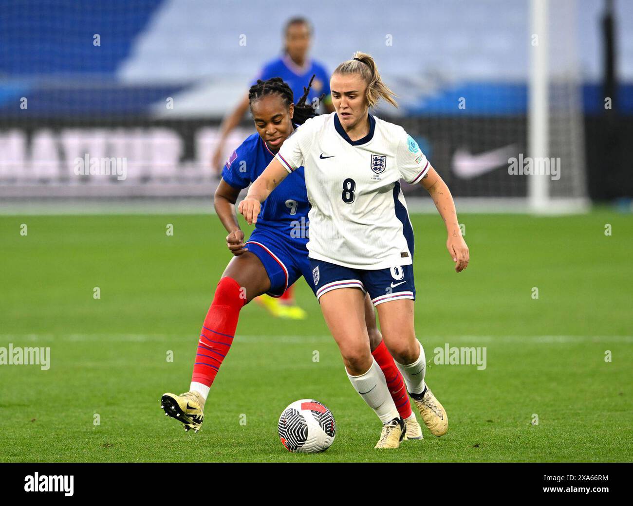 France's Katoto and England's Stanway battle