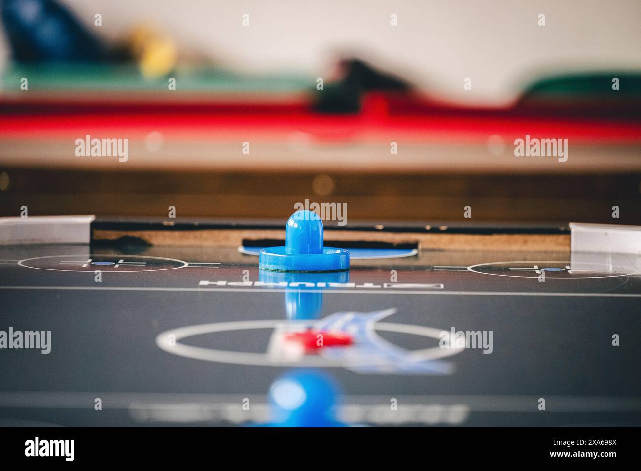 An air hockey table covered in multiple pucks Stock Photo Alamy