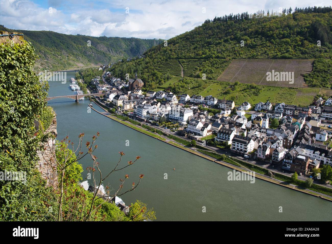 An aerial view of a river alongside a town in mountains Stock Photo - Alamy