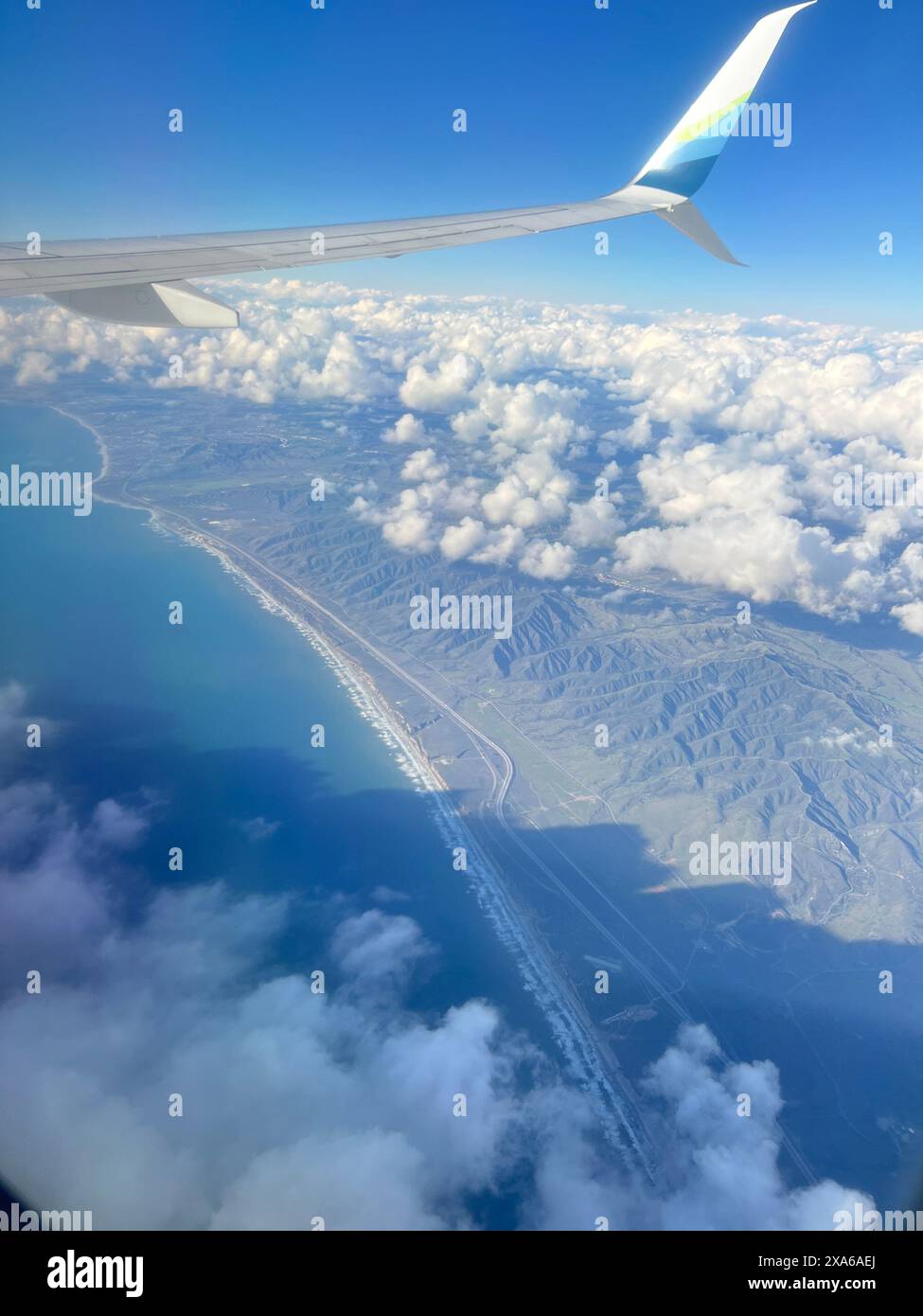 Clouds land below from airplane hi-res stock photography and images - Alamy
