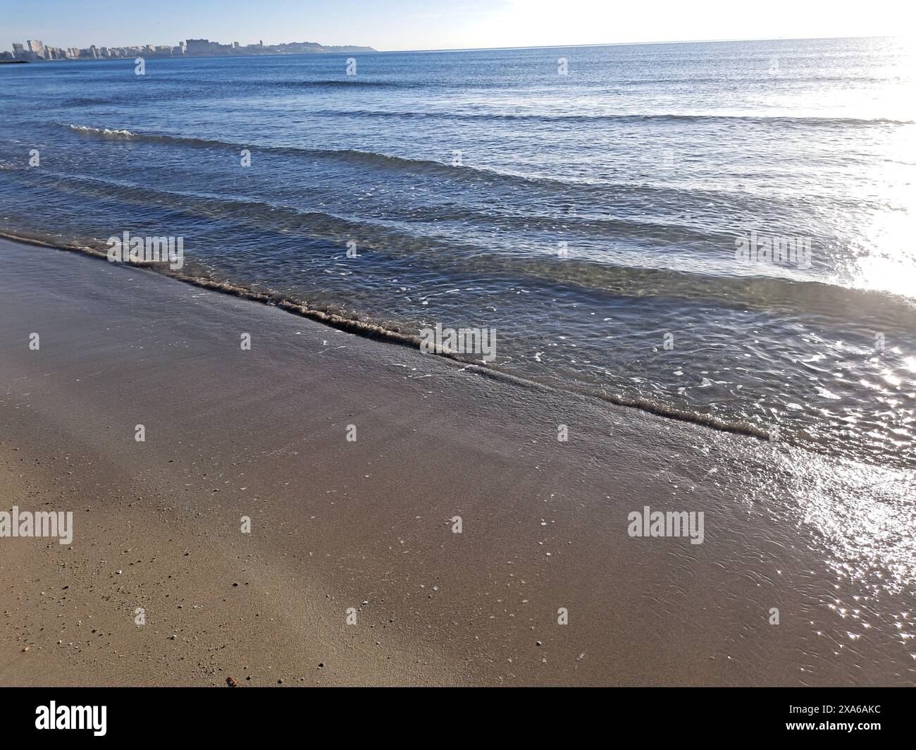 A scenic view of vast ocean and sandy beach Stock Photo