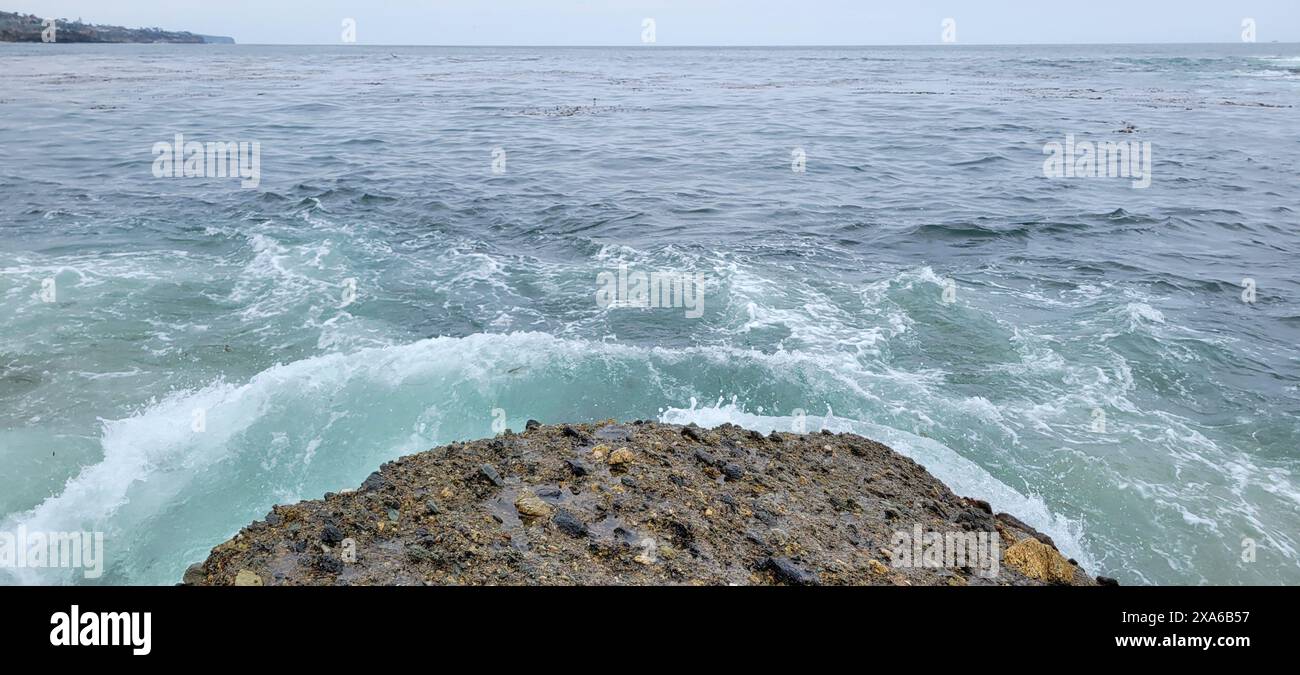A view of ocean waves crashing from a boat's perspective Stock Photo