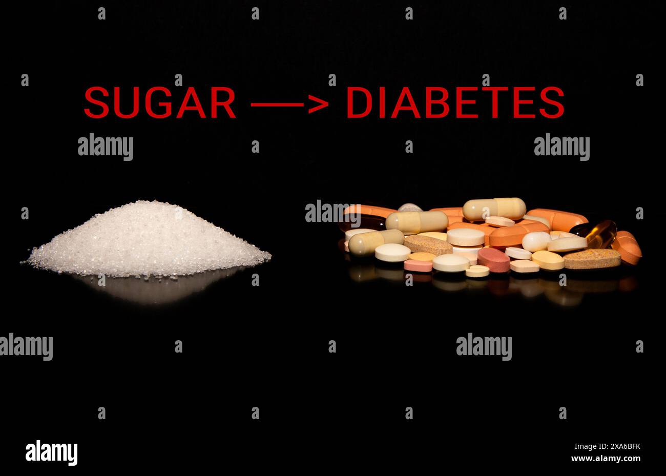 A pile of sugar and a pile of medicine tablets on a black background saying SUGAR LEADS TO DIABETES Stock Photo