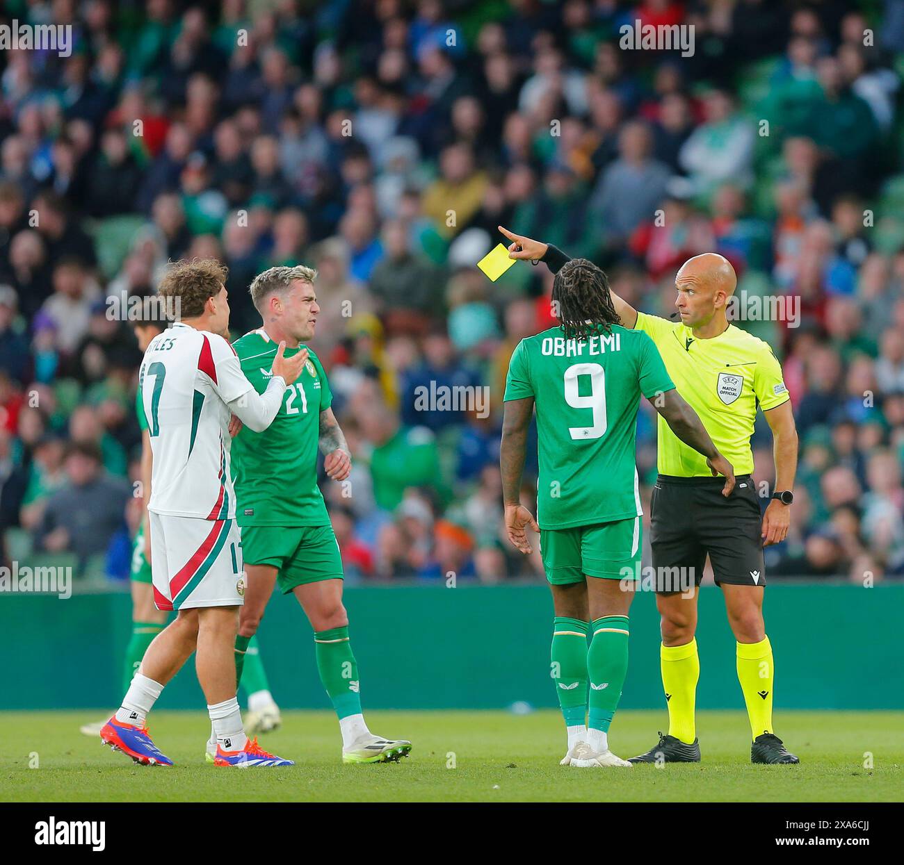 Aviva Stadium, Dublin, Ireland. 4th June, 2024. International Football Friendly, Republic of Ireland versus Hungary; referee Luis Godinho shows the yellow card to Jason Knight of Ireland Credit: Action Plus Sports/Alamy Live News Stock Photo