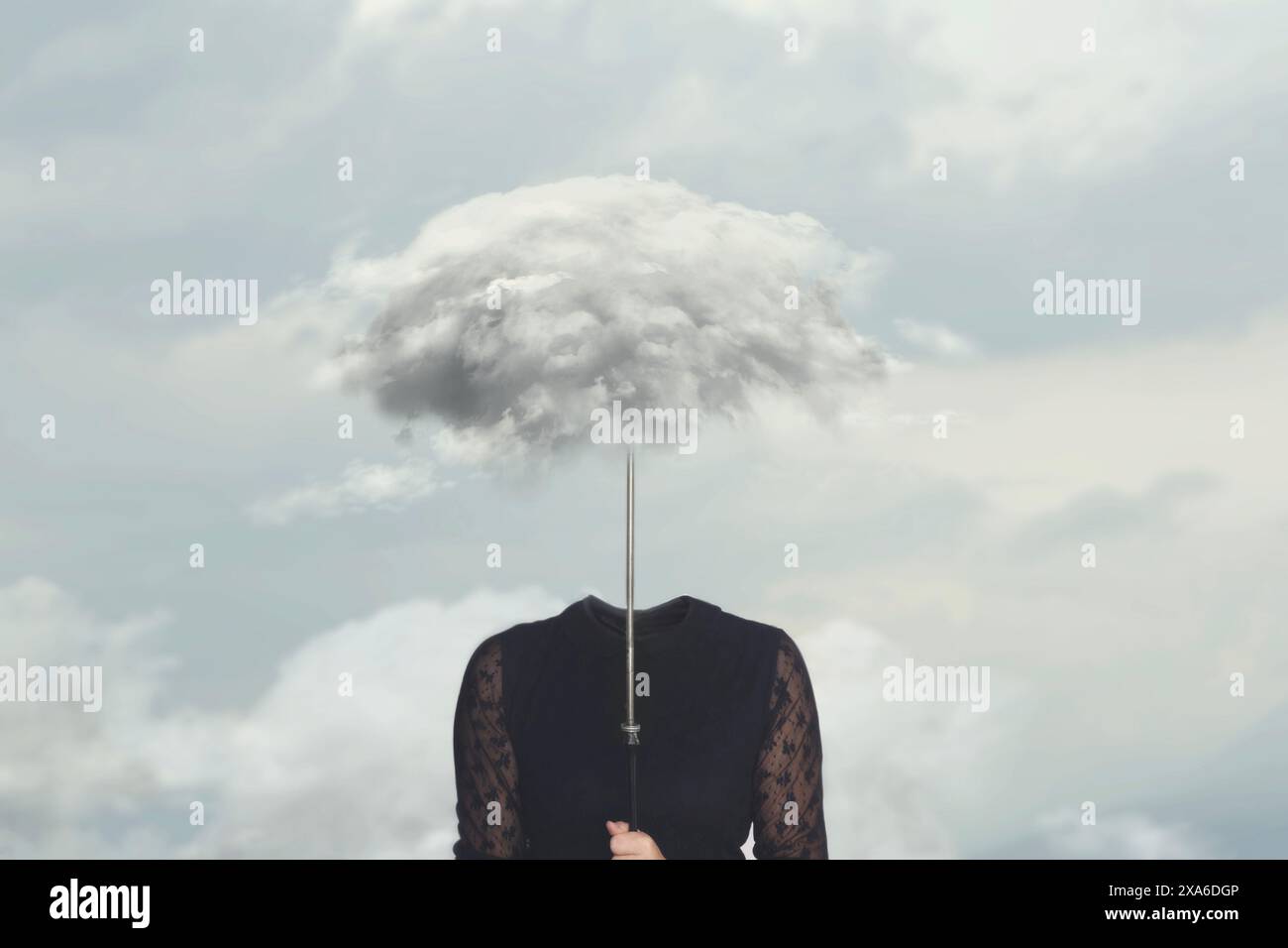 surreal small cloud hides a woman's face, concept of freedom Stock Photo