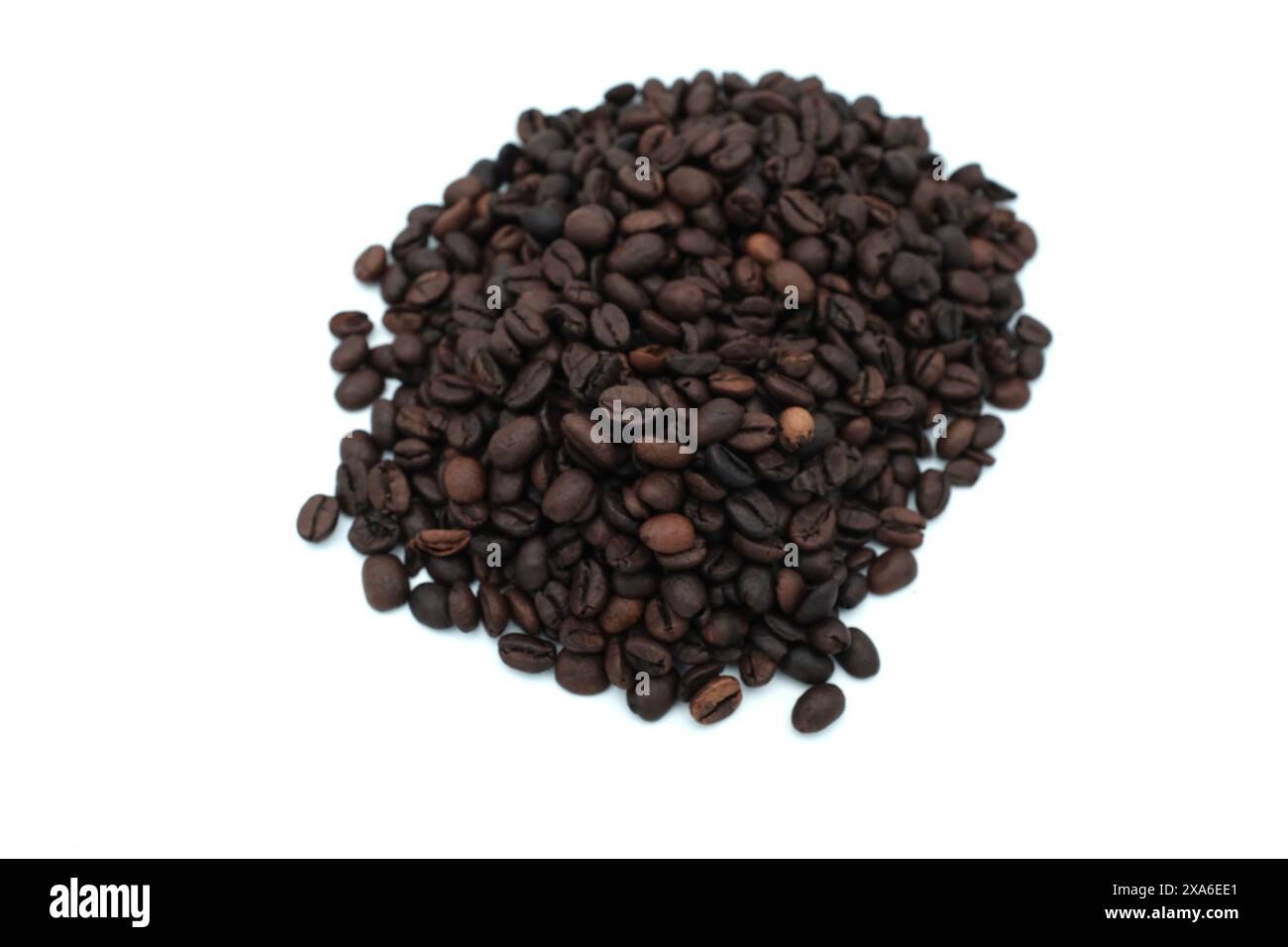 A closeup of roasted coffee beans on a white background Stock Photo