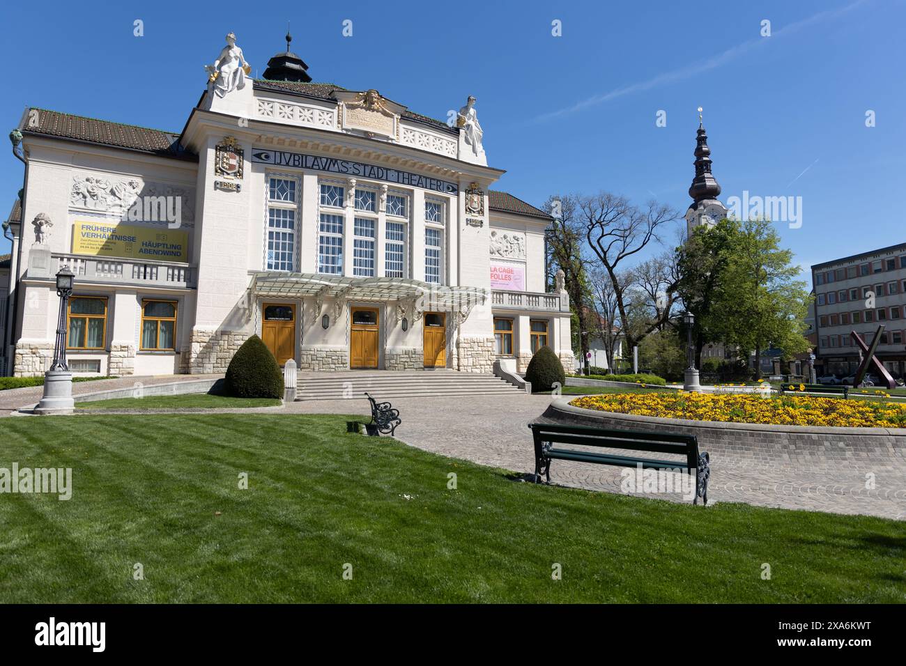 White Klagenfurt, municipal theatre building surrounded by flowers and