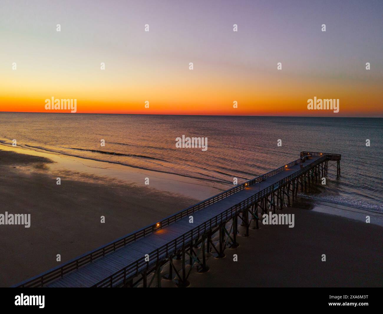 A beautiful view of a sunrise over Isle of Palms beach in Charleston Stock Photo