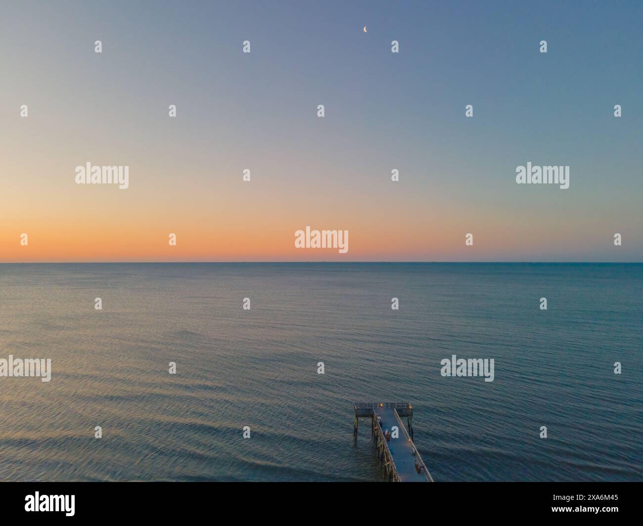 A beautiful view of a sunrise over Isle of Palms beach in Charleston Stock Photo