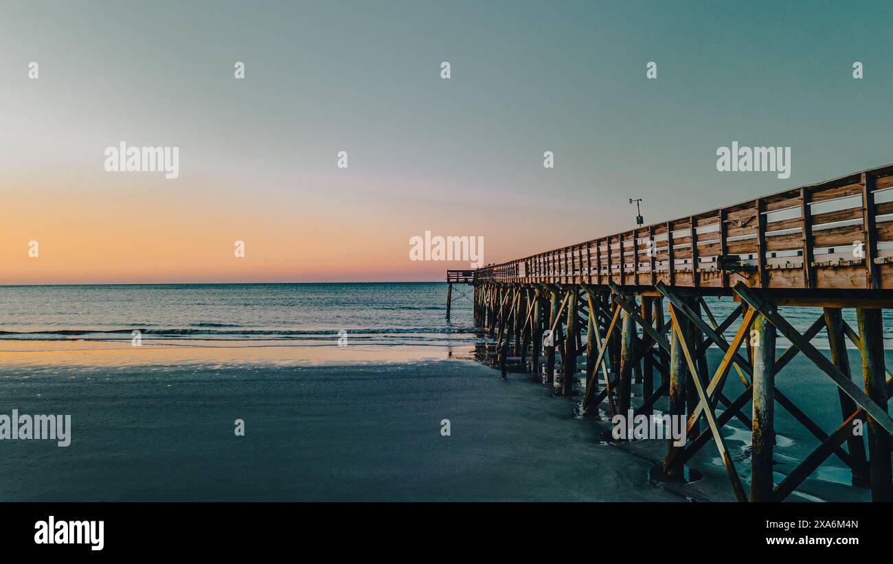A beautiful view of a sunrise over Isle of Palms beach in Charleston Stock Photo