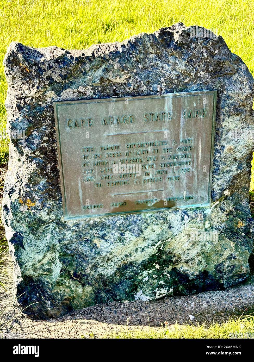 The Cape Arago State Park sign on the rock near Charleston, OR Stock Photo