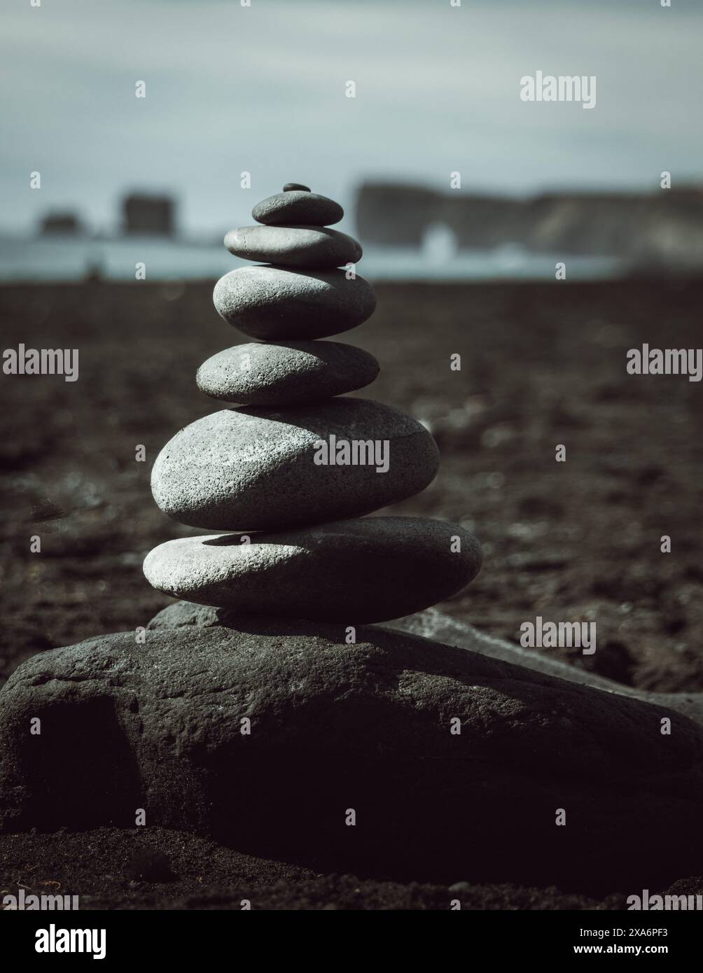 Cairns on Reynisfjara's black sand beach Stock Photo