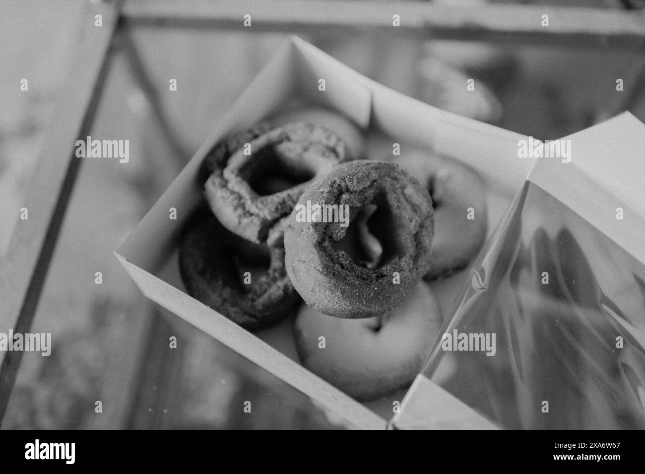 A box of assorted donuts placed on a table Stock Photo