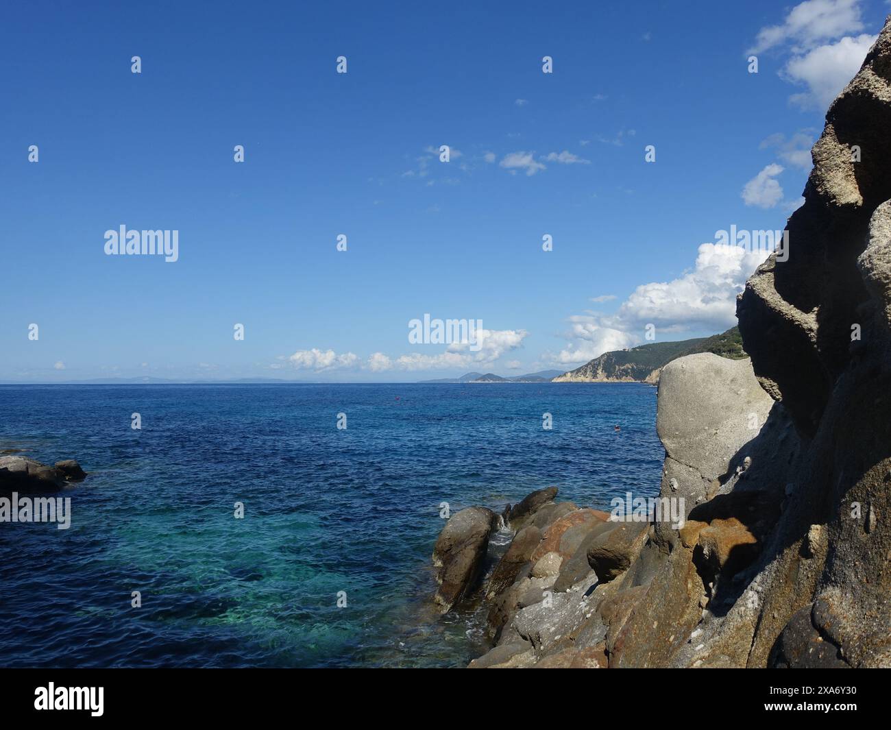 An ocean view with a rocky coastline Stock Photo