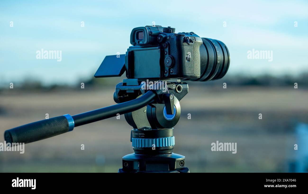 A camera on tripod lined up for a photo shoot Stock Photo - Alamy