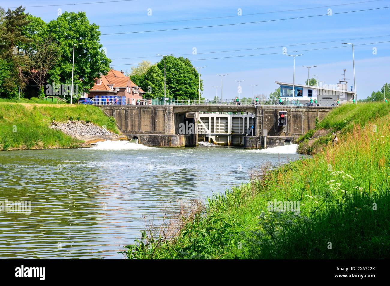 A bridge over water transporting heavy cargo Stock Photo
