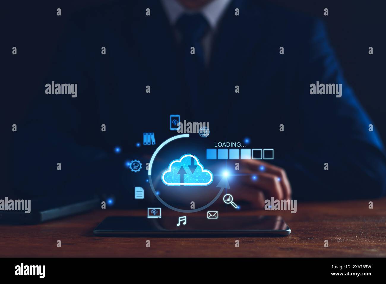 Data download from cloud computing concept. Man using smartphone and computer to download, upload business information, media files. Cloud computing t Stock Photo