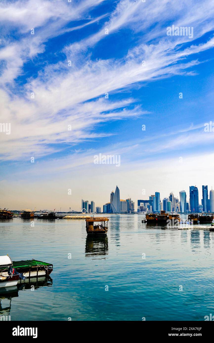 A view of the Persian gulf with boats and buildings in Doha, Qatar ...