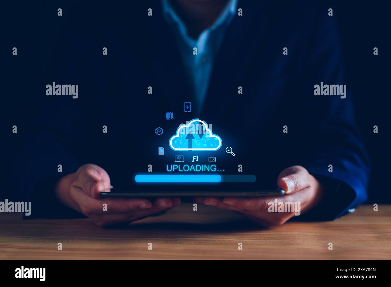 Data upload to cloud storage computing concept. Man using smartphone and computer to upload and download business information, media files. Cloud comp Stock Photo