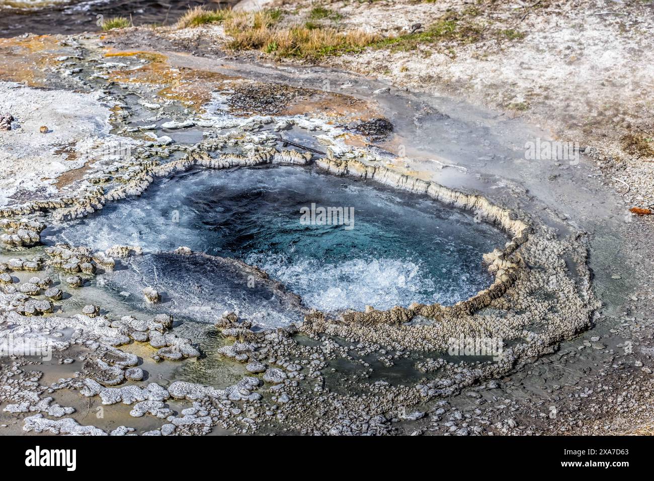 Rocky Hot Spring A hot spring in rocky surroundings under sunny skies Stock Photo - Alamy