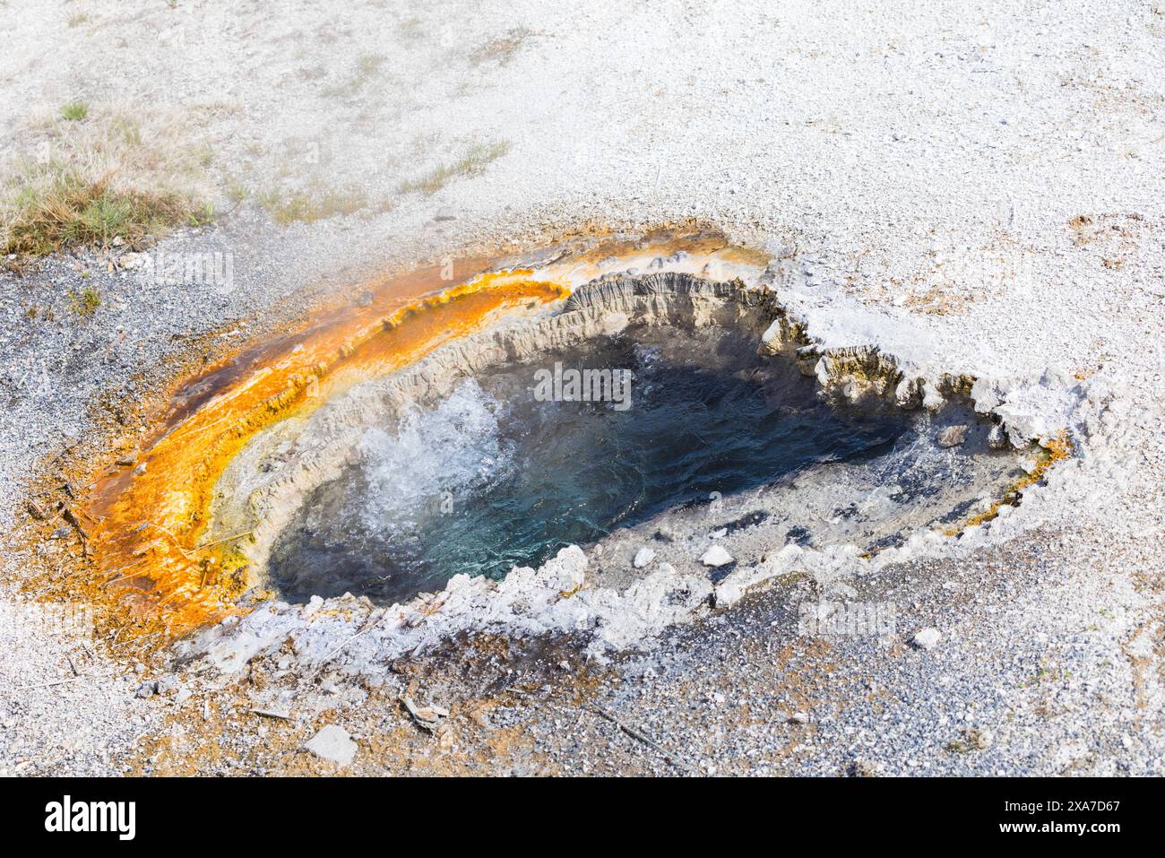 A thermal spring pool set on rocky terrain Stock Photo - Alamy