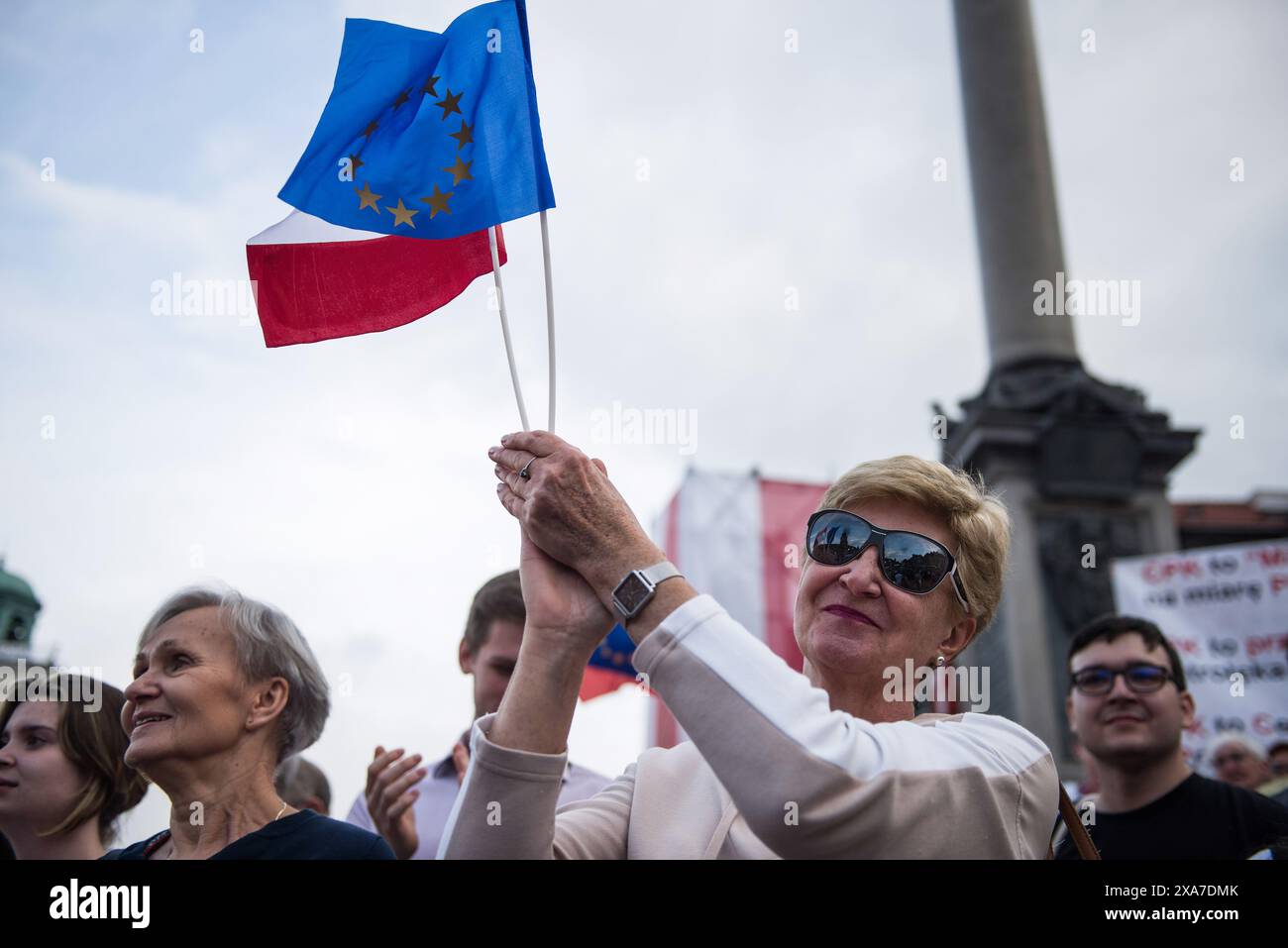 People wave Polish and EU flags during the pro-EU rally organised by ...