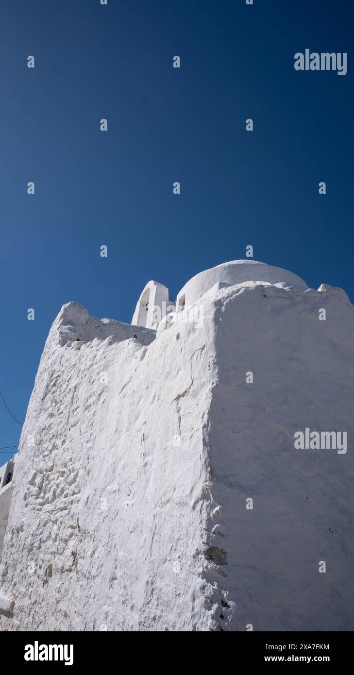 A tiny white house under a clear blue sky Stock Photo - Alamy