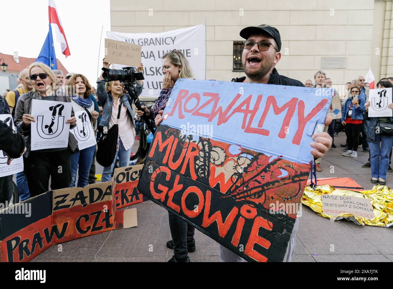 A protester holds a placard with the inscription 