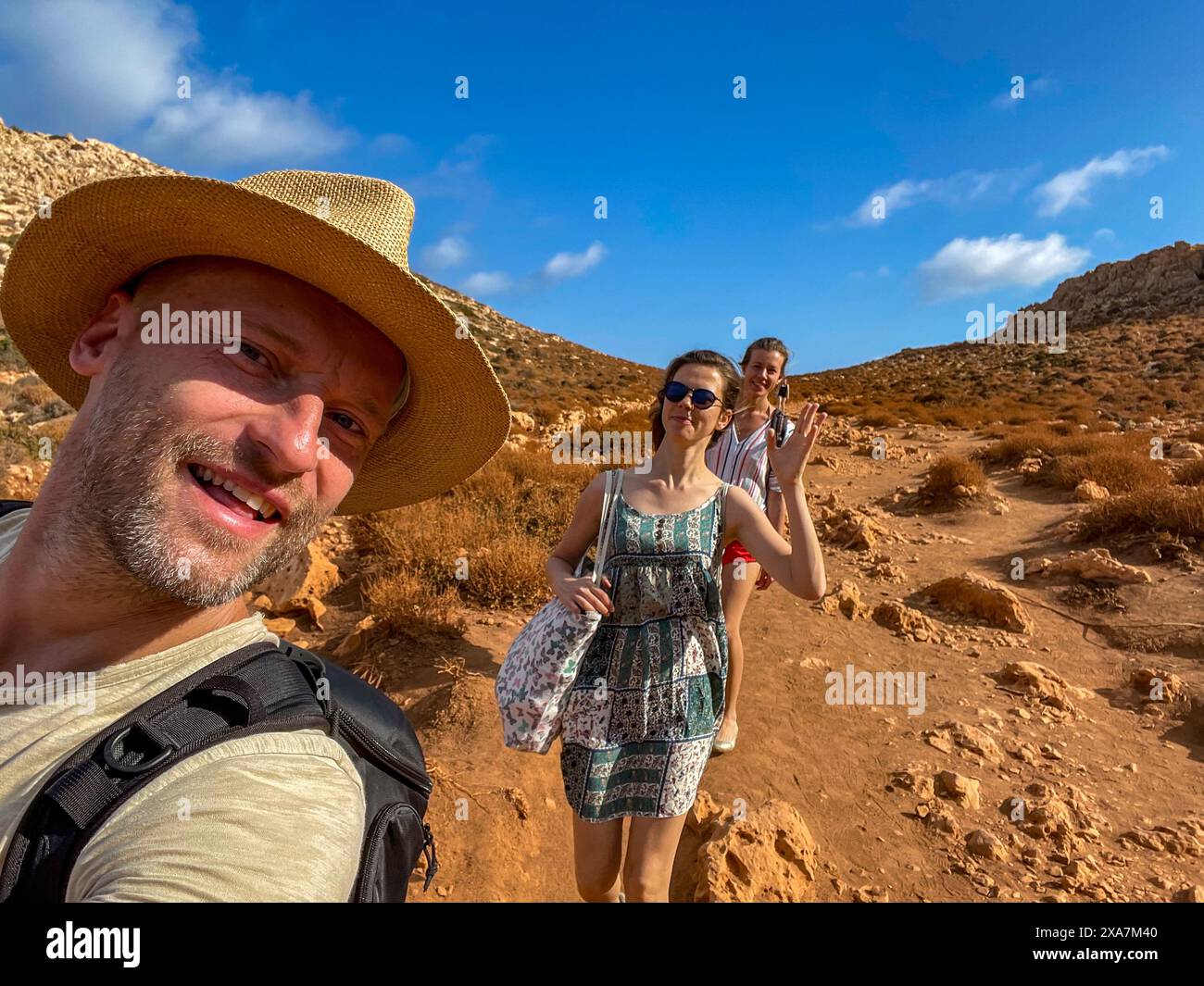 Two hikers taking a selfie during desert trek in Greece Stock Photo - Alamy