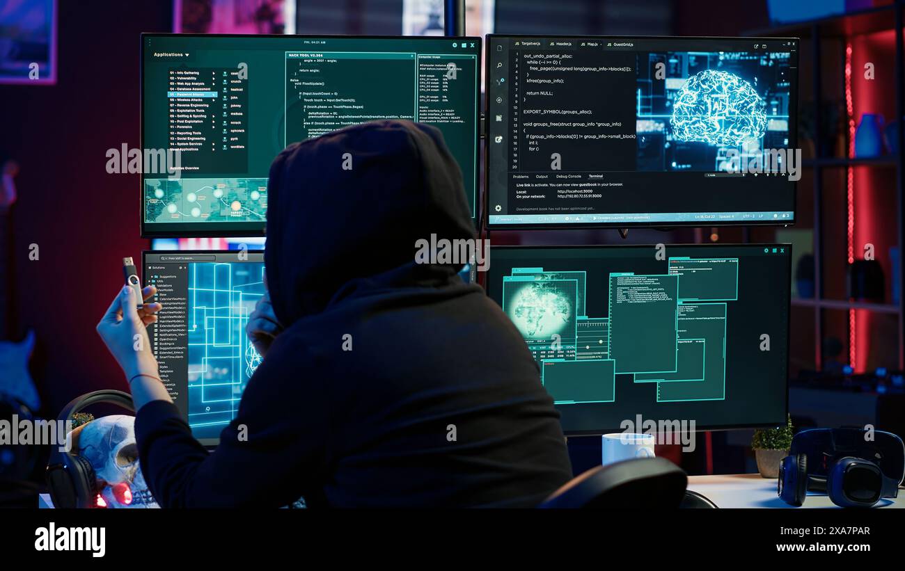 Hacker inserting USB in computer after managing to steal sensitive data, close up. Scammer uploading storage drive into PC after obtaining sensitive information from users using malware, camera A Stock Photo