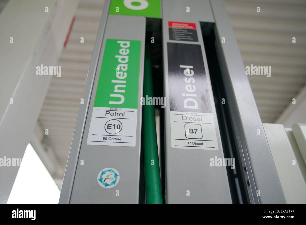 File photo dated 01/09/21 of an E10 petrol pump by a Diesel pump at a Asda Petrol Station in Aintree, Liverpool. According to new analysis from the RAC, Asda has become the UK's most expensive supermarket fuel retailer, with rival companies Tesco, Morrisons and Sainsbury's selling a litre of petrol for an average of 2.1p less than Asda at the end of May. Issue date: Wednesday June 5, 2024. Stock Photo