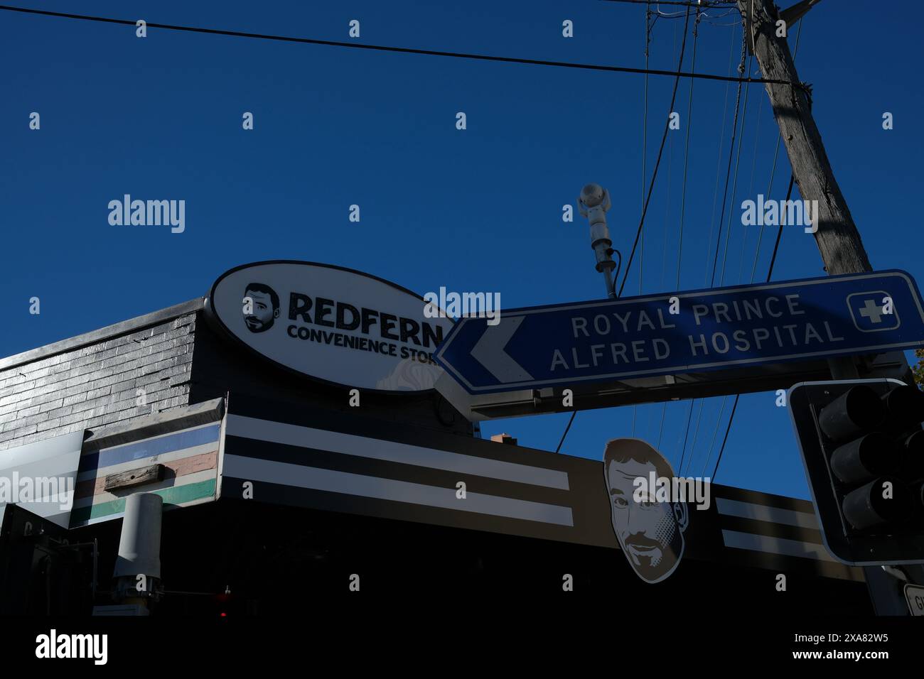 Awning signage, Redfern Convenience Store a Mans Face & road signs at