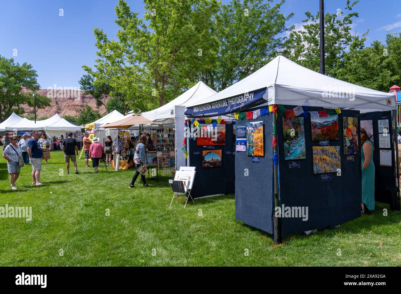 People browsing and shopping at the annual Moab Arts Festival in Moab