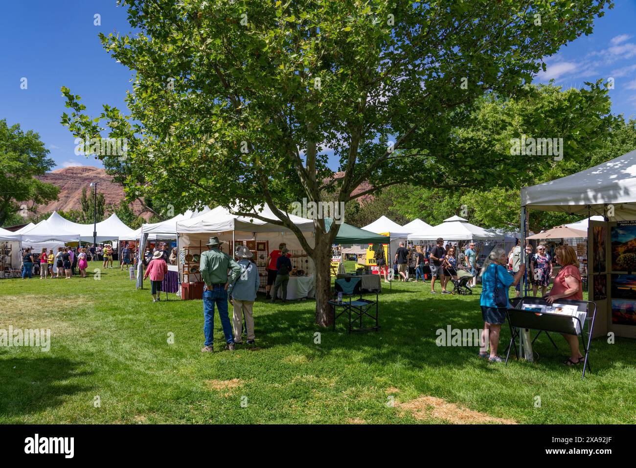 People browsing and shopping at the annual Moab Arts Festival in Moab