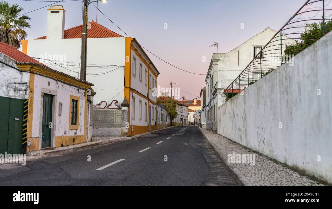 Buildings along a roadway of Setúbal, Portugal, which is a busy port ...