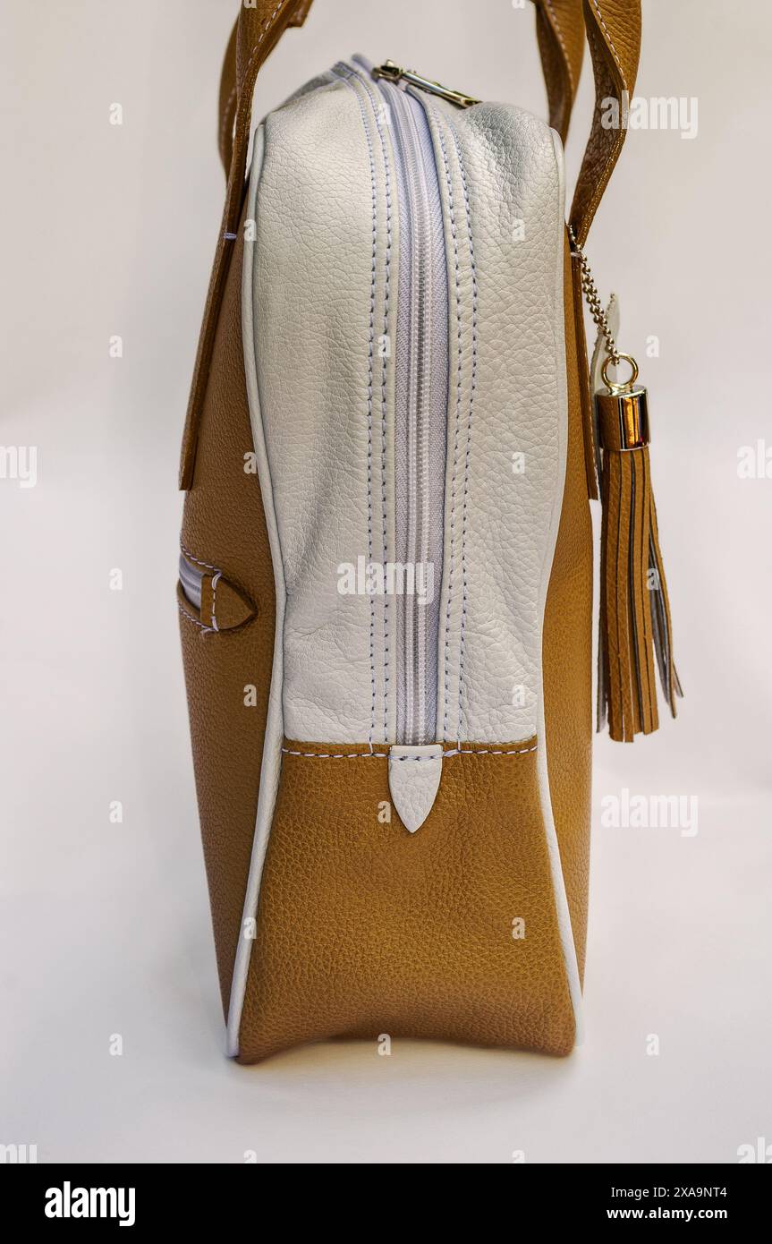 White bag with tan fringe strap Stock Photo