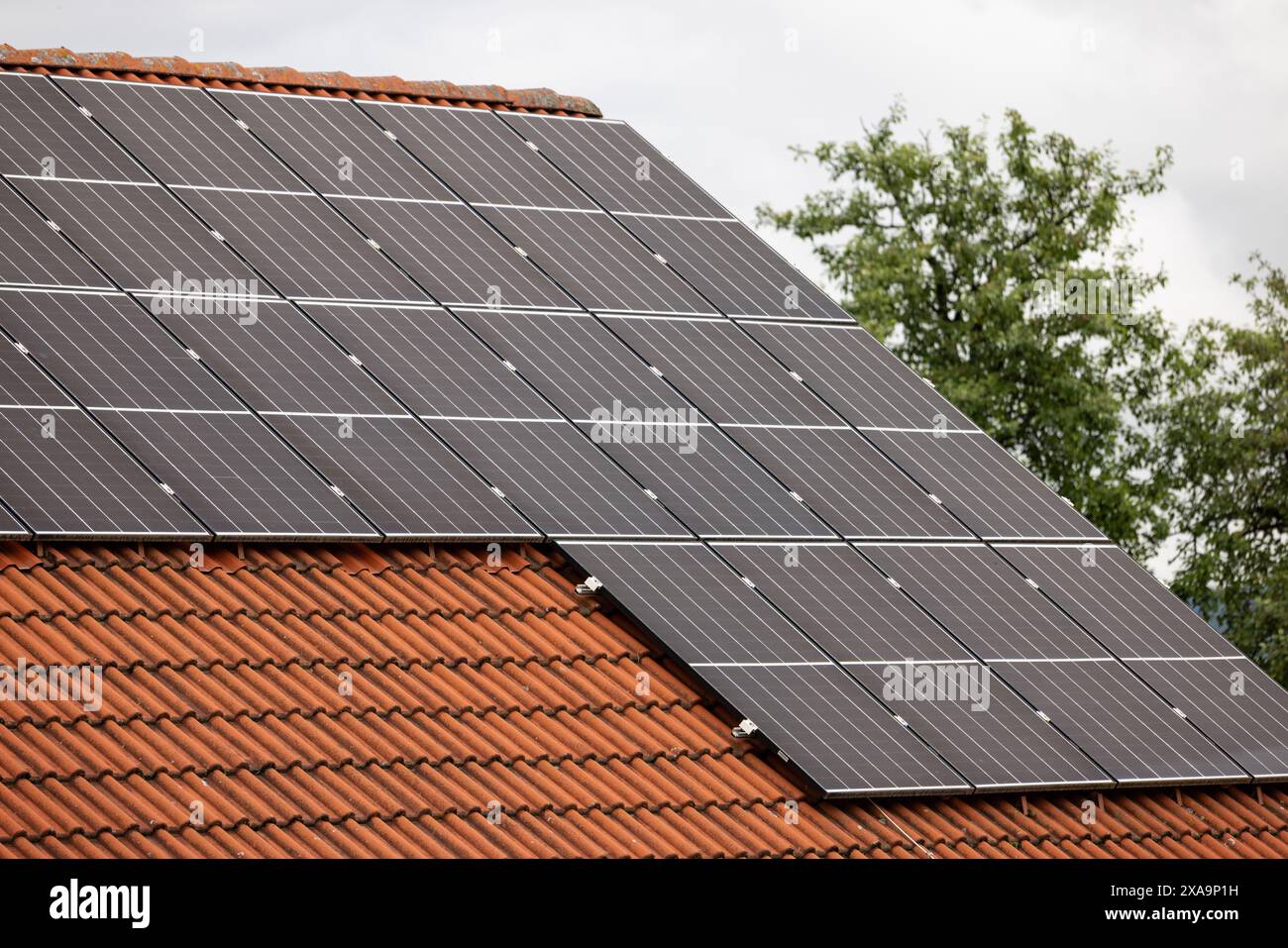 A closeup of solar panels installed on a suburban home's rooftop Stock ...