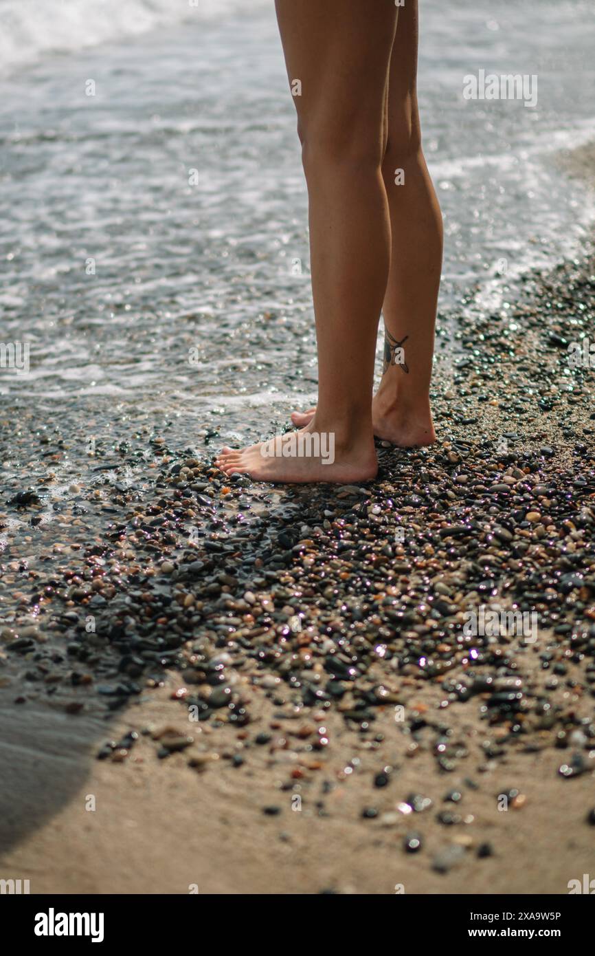Woman stands on shore ocean hi-res stock photography and images - Alamy