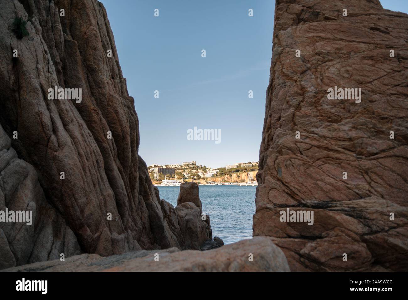 Scenic beach view with rocks and ocean in foreground Stock Photo - Alamy