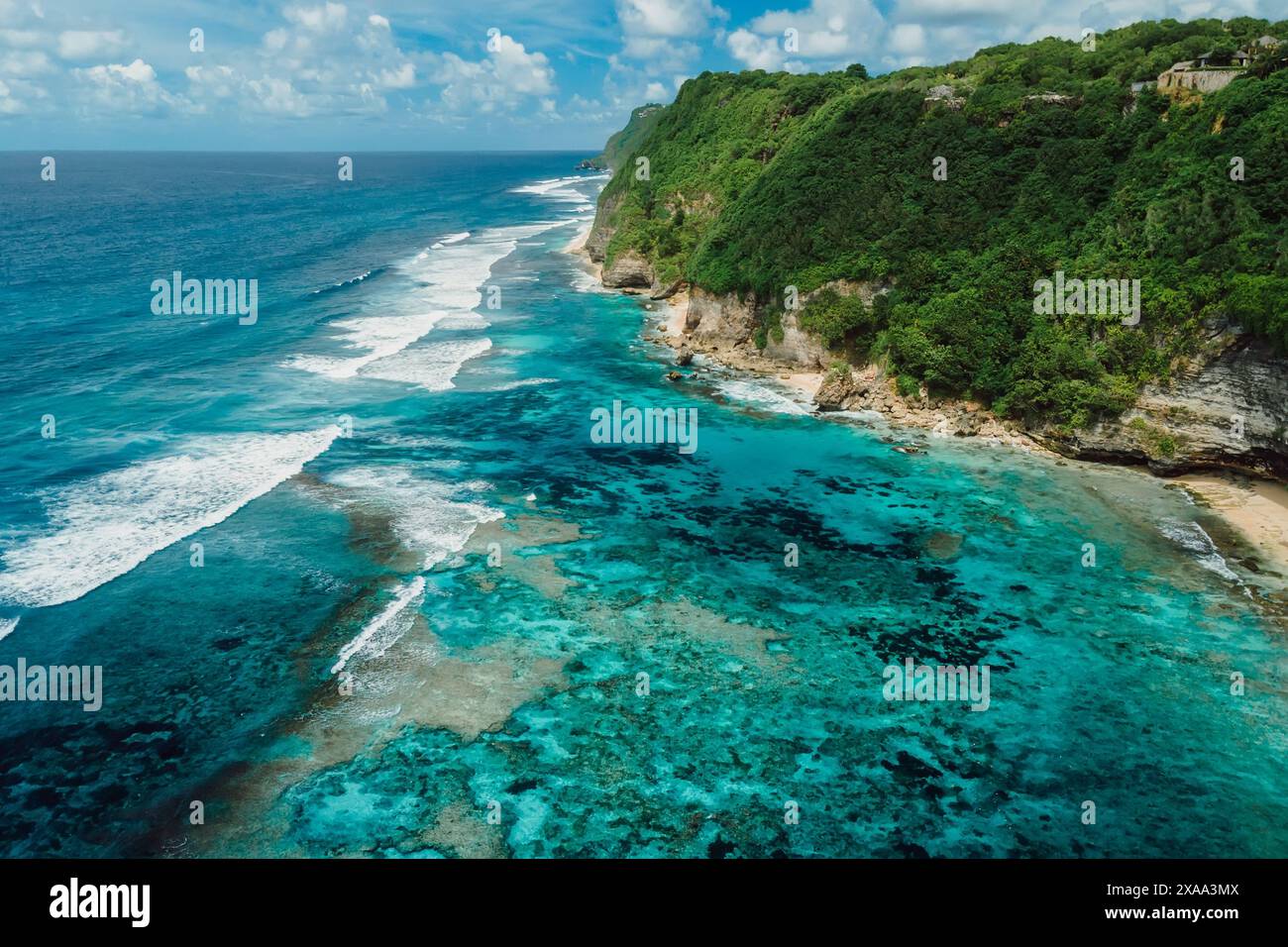 Beautiful coastline with turquoise ocean and green cliffs in Bali. Aerial view Stock Photo